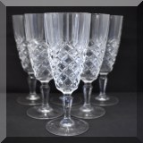 G52. 10 Pressed glass champagne flutes. - $60 